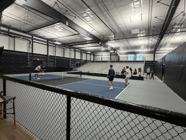 Stadium Court at Greystone with bleacher seating along the far side and players on the court